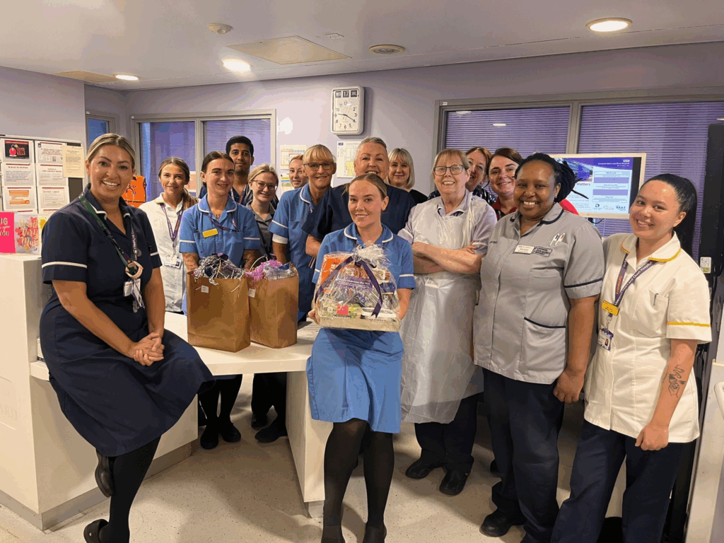 Staff members holding chocolate bars during the “Have a Break, Have a KitKat” campaign, promoting survey participation in a relaxed setting