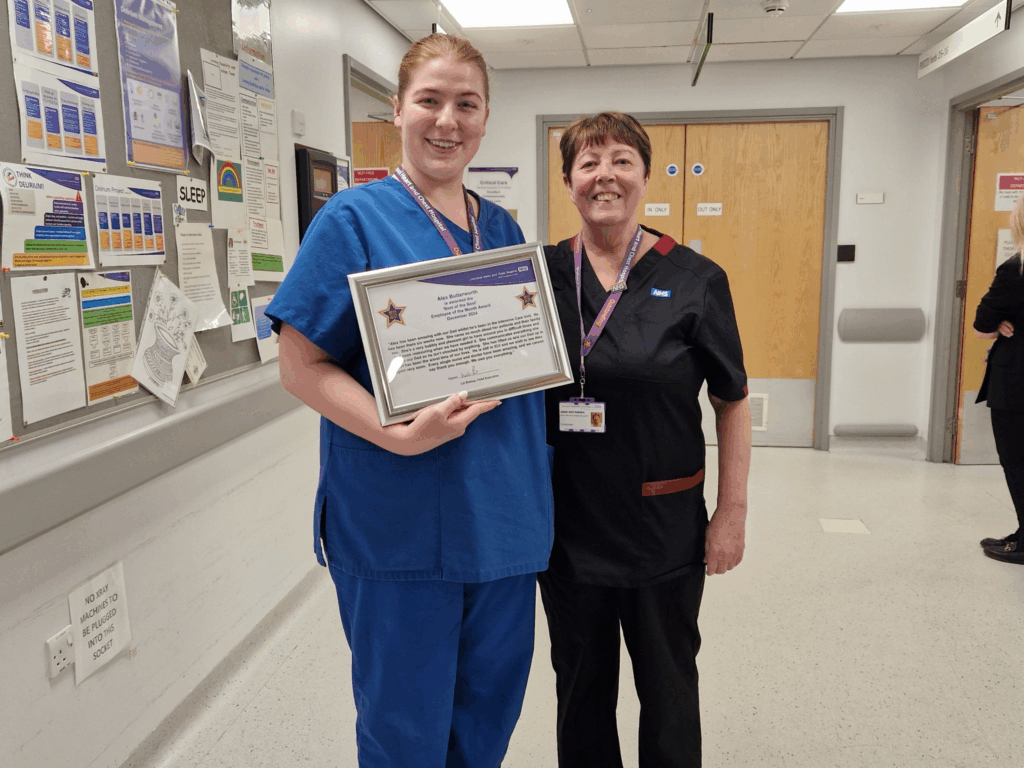 Photo of a Liverpool Heart and Chest NHS Foundation Trust staff member receiving a employee of the month award.