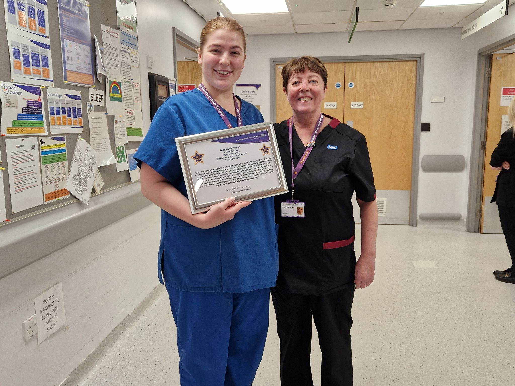 Photo of a Liverpool Heart and Chest NHS Foundation Trust staff member receiving a employee of the month award.