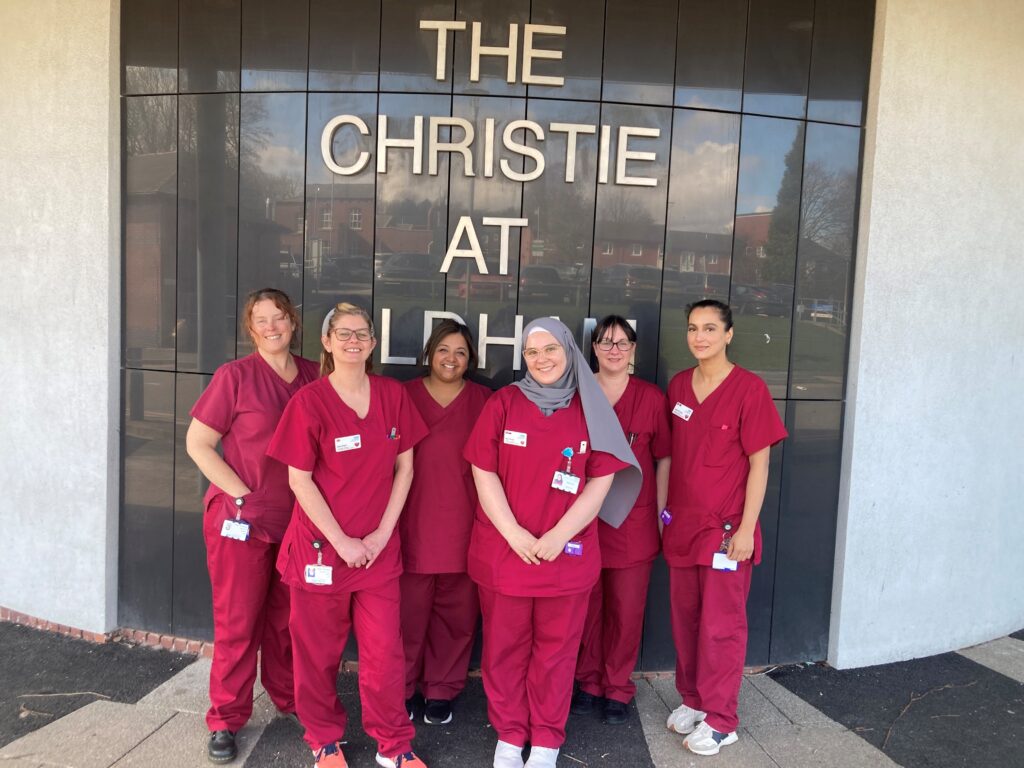A team of Christie staff stood outside of their Oldham site.